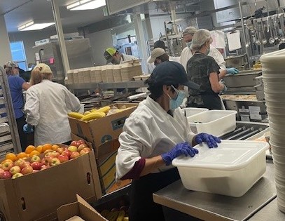 MOWMP staff preparing meals for delivery to the dining sites